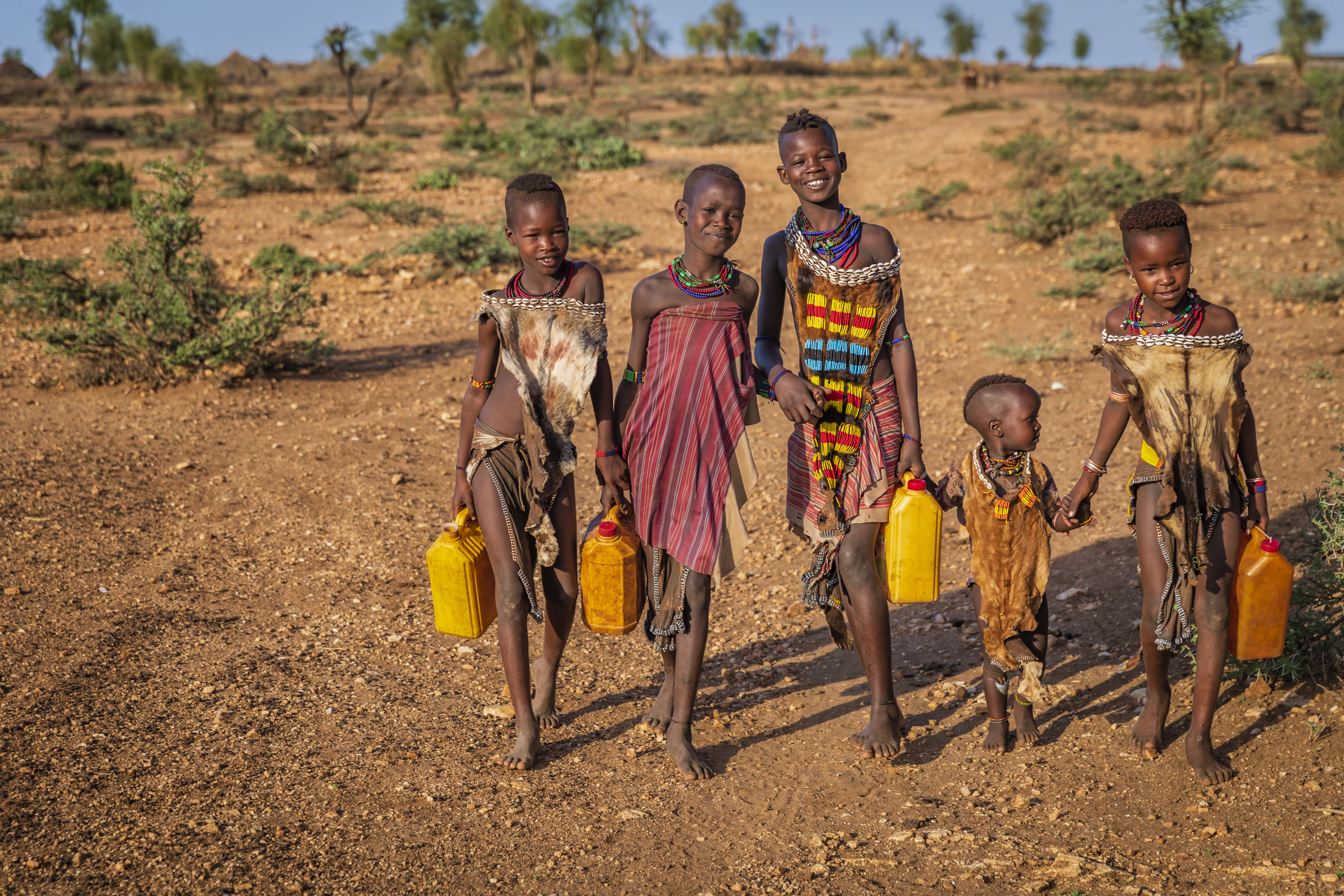 Children carrying water containers in Ethiopia